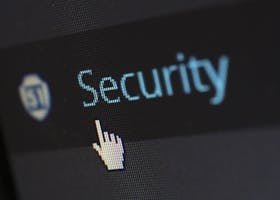 Close-up view of a mouse cursor over digital security text on display.